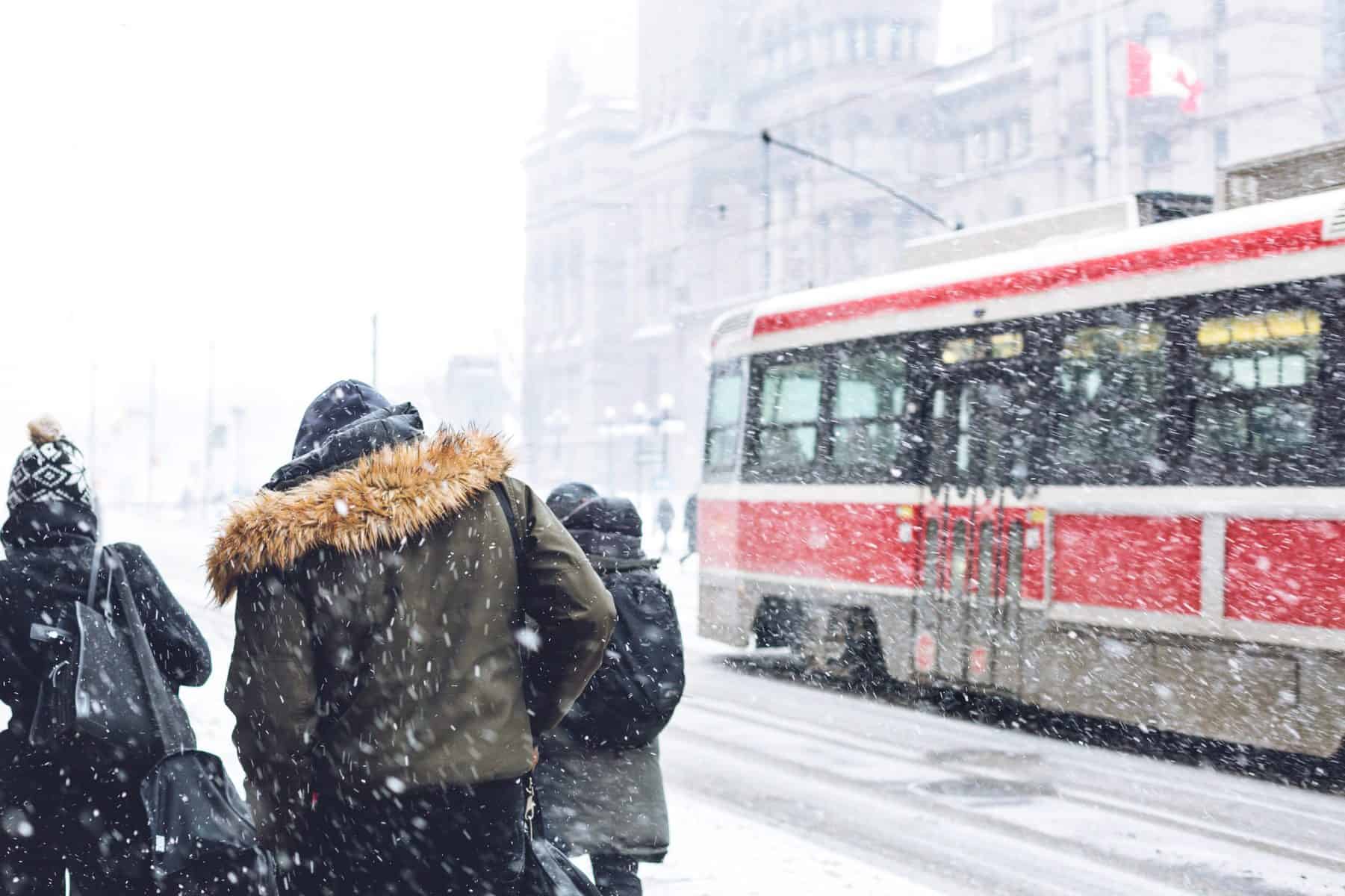 snowy city walking commute scaled